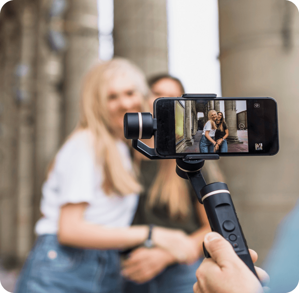 Person taking photos with phone gimbal
